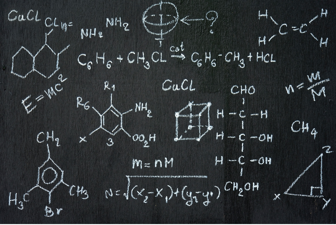 Chalkboard full of chemical and mathematical symbols
