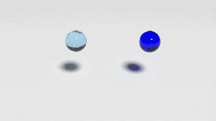An animation of 2 balls of fluid dropping and filling a container.  The first ball looks transparent like water and splashes rapidly and fills the bottom of the container.  The ball on the right is dark blue and slowly spreads out on the bottom of the container.