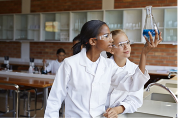 Two students in the lab ... doing Chemistry.