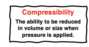 Definition of compressibility as the ability to reduce volume or size when pressure is applied.