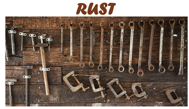 Photo of several rusted tools. Rusting is an example of a spontaneous process.
