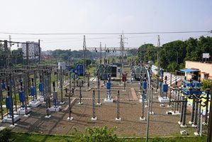 Picture of an electric substation, which has many transformers to convert the high voltage to a lower voltage.