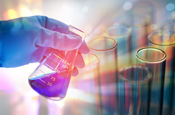 Photo: Chemist performing a procedural step.